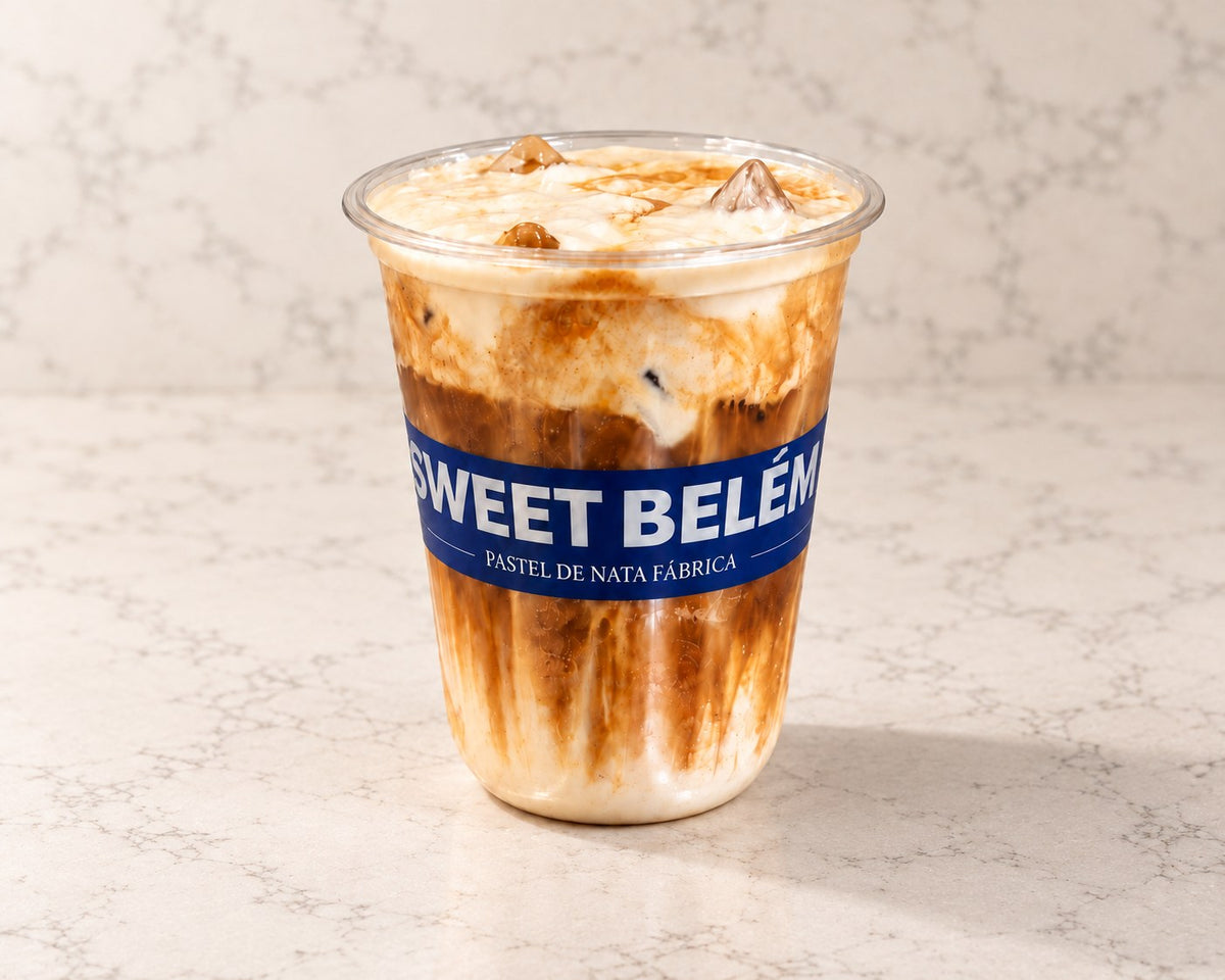 Sweet Belém Cloud Latte, iced and marbled in a branded cup